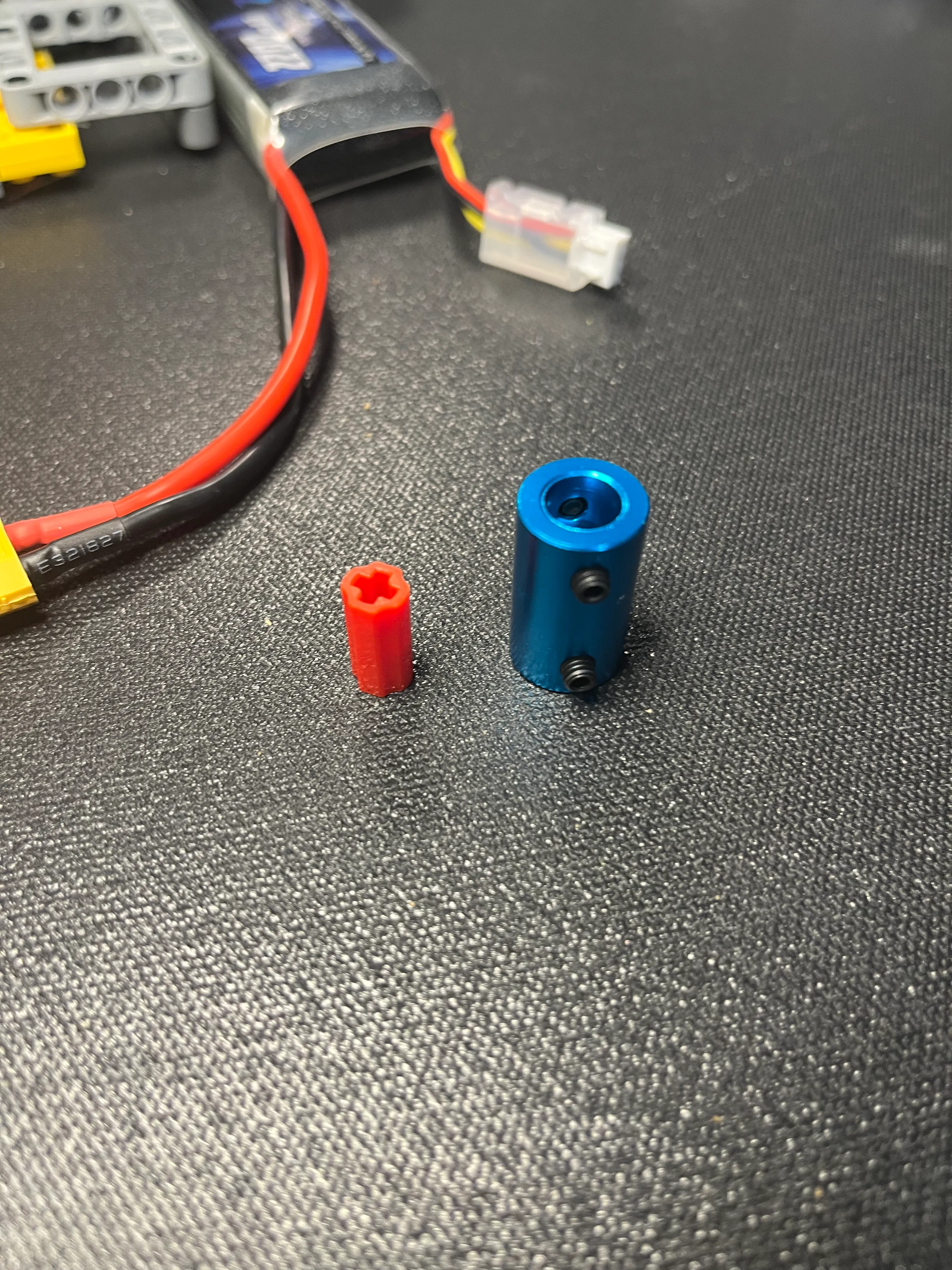 6mm to 8mm aluminum bore coupler connecting the DC motor to the Technic axle